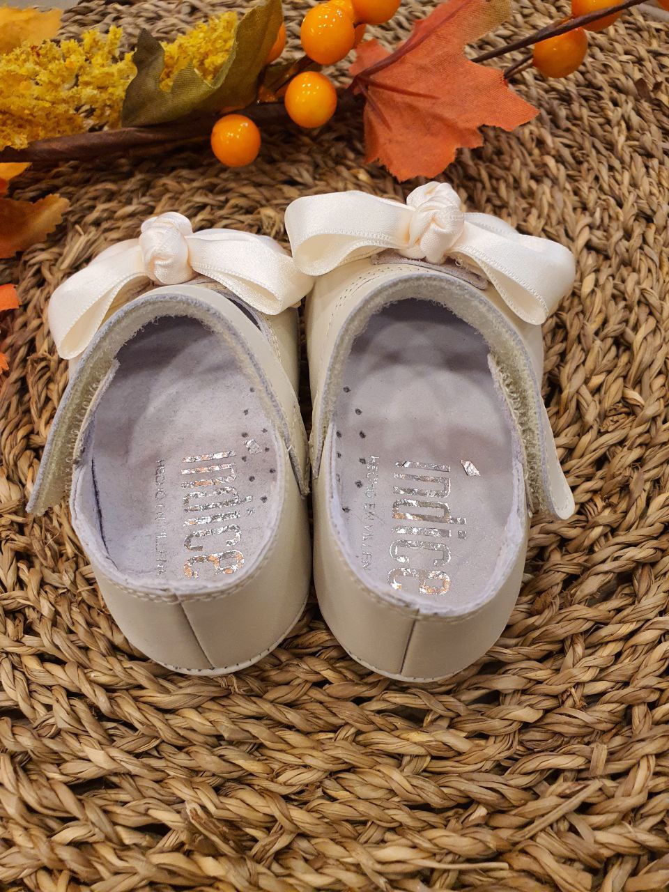 BAMBOLINA CON FIOCCO IN TESSUTO BEIGE INDICE