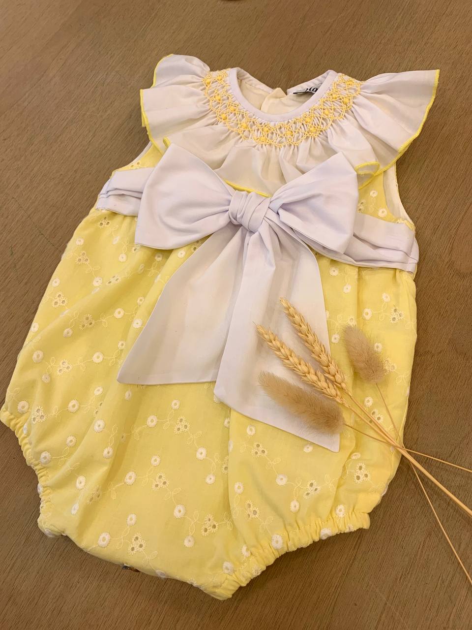 PAGLIACCETTO GIALLO CON FIOCCO NAXOS