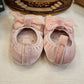 BAMBOLINA IN CAMOSCIO ROSA CON FIOCCO INDICE