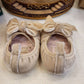 BAMBOLINA IN CAMOSCIO BEIGE CON FIOCCO INDICE