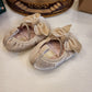 BAMBOLINA IN CAMOSCIO BEIGE CON FIOCCO INDICE