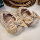 BAMBOLINA IN CAMOSCIO BEIGE CON FIOCCO INDICE