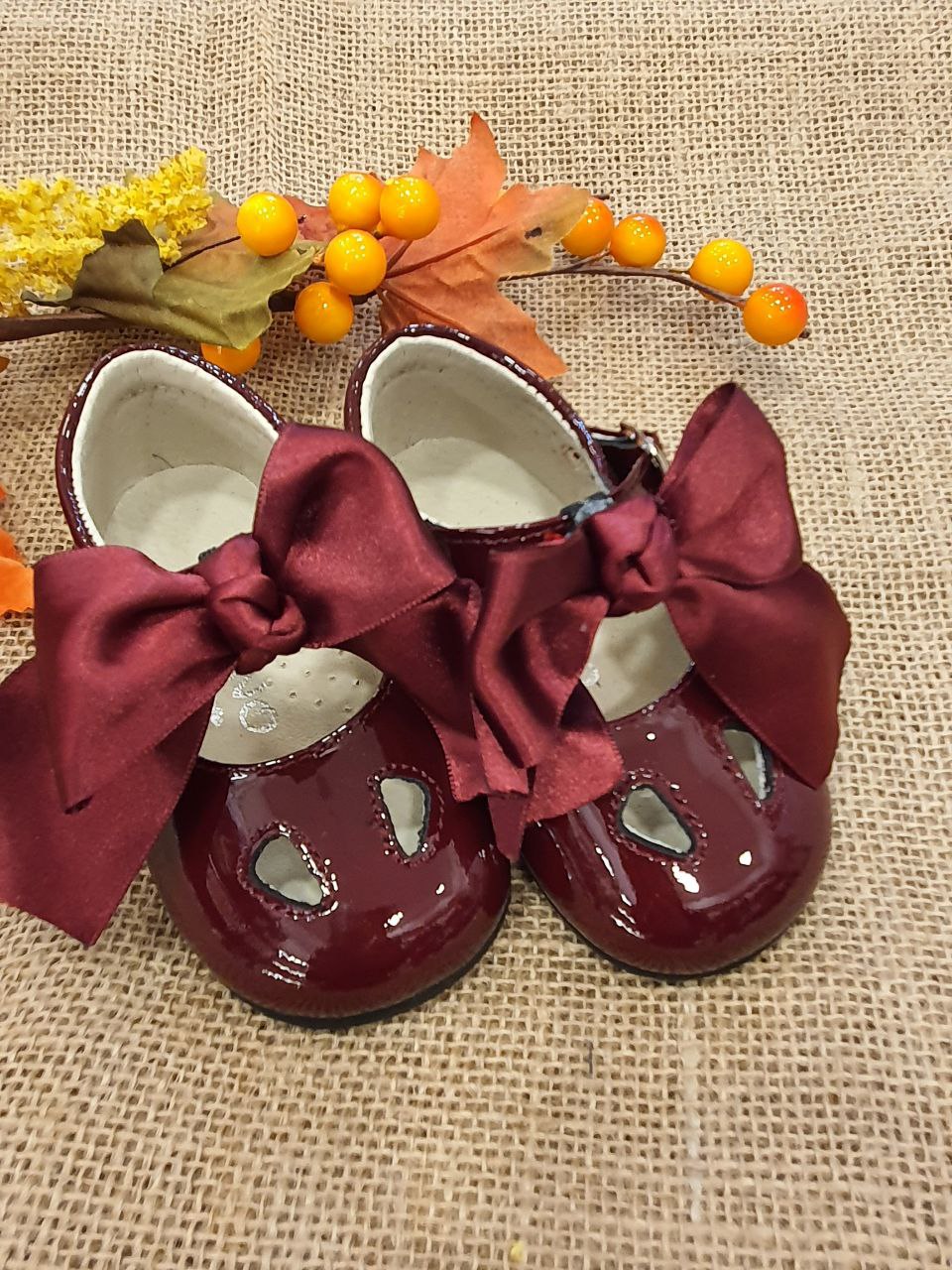 OCCHIELLO LUCIDO CON FIOCCO BORDEAUX PANYNO