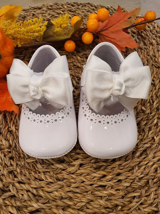 BAMBOLINA LUCIDA CON FIOCCO IN TESSUTO BIANCO INDICE