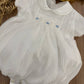 PAGLIACCETTO BATTESIMALE PUNTO SMOCK BIANCO E CELESTE CHARO