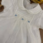 PAGLIACCETTO BATTESIMALE PUNTO SMOCK BIANCO E CELESTE CHARO