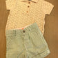 Completo polo traforata e shorts a righe